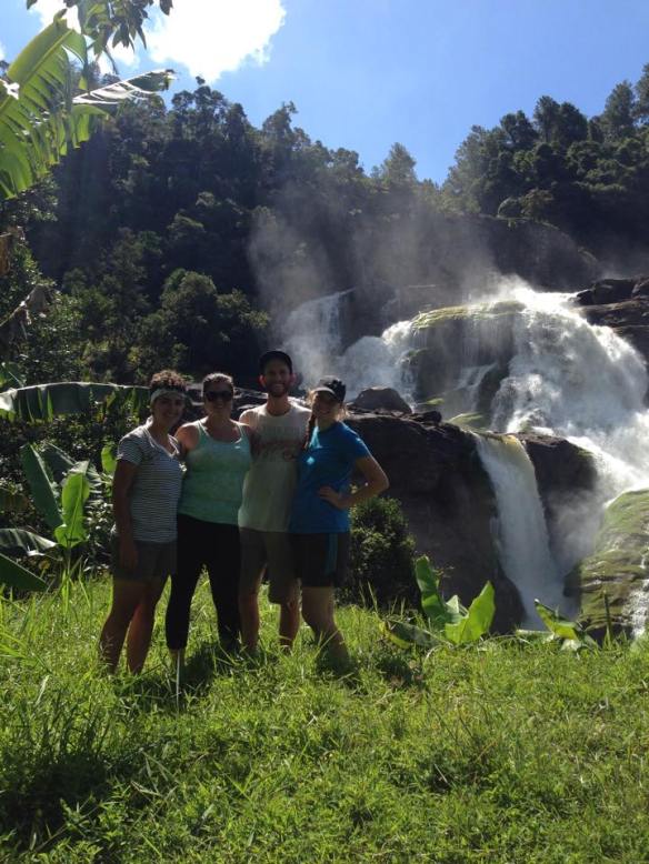 Standing in front of the waterfall during our hike through Ranomafana National Park